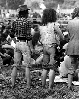 Pop Festival August 1977 Hippy Festival goers stand up to their ankles in mud with Pop Festival August 1977 Hippy Festival goers stand up to their ankles in mud with
