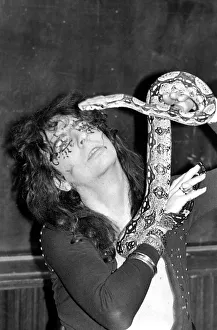 Pop singer Alice Cooper aged 23 flew into Heathrow Airport today with his pet boa Pop singer Alice Cooper aged 23 flew into Heathrow Airport today with his pet boa