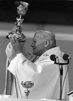 Pope John Paul II blessing the wine during an open air mass held at Wembley Stadium Pope John Paul II blessing the wine during an open air mass held at Wembley Stadium