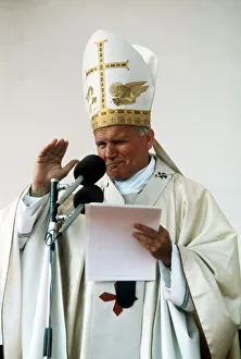 Pope John Paul II delivers his blessing while conducting an open air mass in Bellahouston Pope John Paul II delivers his blessing while conducting an open air mass in Bellahouston