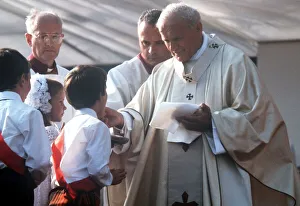 Pope John Paul II gives Holy Communion at Bellahouston Park in Glasgow, Scotland Pope John Paul II gives Holy Communion at Bellahouston Park in Glasgow, Scotland