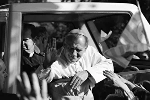 Pope John Paul II waves to the congregation from his pope mobile following an open air Pope John Paul II waves to the congregation from his pope mobile following an open air