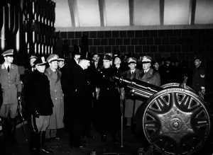 Prime Minsiter Neville Chamberlain visits a munitions factory in Italy Circa 1937 Prime Minsiter Neville Chamberlain visits a munitions factory in Italy Circa 1937