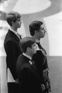 Prince Charles, flanked by his brothers Edward and Andrew waits patiently in front of Prince Charles, flanked by his brothers Edward and Andrew waits patiently in front of