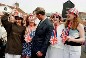 Prince Charles is greeted by a group of local residents (dressed for the occasion Prince Charles is greeted by a group of local residents (dressed for the occasion