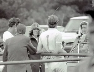 Prince Charles leans back on to railings as he chats with Camilla Parker Bowles during a Prince Charles leans back on to railings as he chats with Camilla Parker Bowles during a