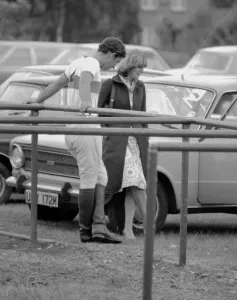 Prince Charles leans back on to railings as he chats with Camilla Parker Bowles during a Prince Charles leans back on to railings as he chats with Camilla Parker Bowles during a