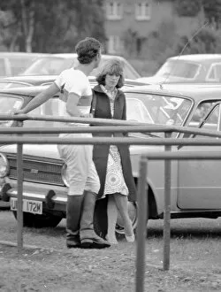 Images Dated 18th June 1975: Prince Charles leans back on to railings as he chats with Camilla Parker Bowles during a