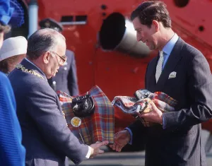 Prince Charles receiving a kilt from Lord Provost Robert Gray at the Glasgow Garden Prince Charles receiving a kilt from Lord Provost Robert Gray at the Glasgow Garden