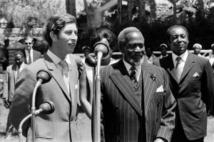 Prince Charles watches a traditional dance of welcome alongside the President of Kenya Prince Charles watches a traditional dance of welcome alongside the President of Kenya