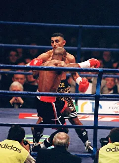 Prince Naseem Hamed corners Tom Boom Boom Johnson against the ropes in their IBF world Prince Naseem Hamed corners Tom Boom Boom Johnson against the ropes in their IBF world