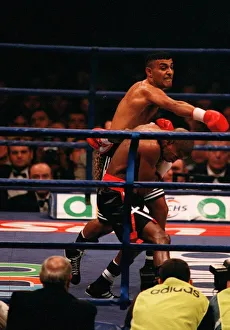 Prince Naseem Hamed lands a punch on Tom Boom Boom Johnson in their IBF world feather Prince Naseem Hamed lands a punch on Tom Boom Boom Johnson in their IBF world feather