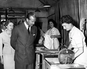 Prince Philip, Duke of Edinburgh at the Empire Village watching washing machines for Prince Philip, Duke of Edinburgh at the Empire Village watching washing machines for