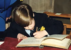 Prince William signing his name in the visitors book of Llandaff Cathedral in Cardiff Prince William signing his name in the visitors book of Llandaff Cathedral in Cardiff