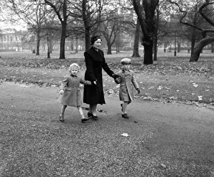 Princess Anne (4) and Prince Charles (6) walk through Green Park with their Governess Princess Anne (4) and Prince Charles (6) walk through Green Park with their Governess