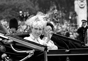 Princess Anne and Princess Margaret waving from a carriage for the wedding of Prince Princess Anne and Princess Margaret waving from a carriage for the wedding of Prince