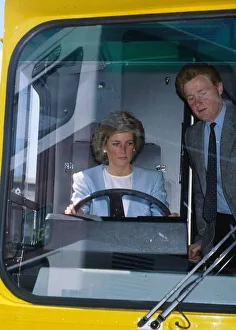Princess Diana, Princess of Wales at the wheel of a bus watched by John Fowler during a Princess Diana, Princess of Wales at the wheel of a bus watched by John Fowler during a