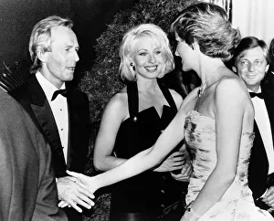 Princess Diana shakes hands with Australian actor Paul Hogan at the premiere of his film Princess Diana shakes hands with Australian actor Paul Hogan at the premiere of his film