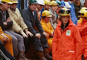 Princess Diana wearing a construction hard hat with protective ear guards Princess Diana wearing a construction hard hat with protective ear guards