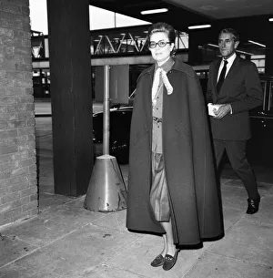 Princess Grace of Monaco, wearing a full length cape, as she arrives at Heathrow Airport Princess Grace of Monaco, wearing a full length cape, as she arrives at Heathrow Airport