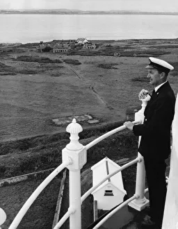 Principal Keeper Colin Nicholls admires the view from the top of the Flat Holm Lighthouse Principal Keeper Colin Nicholls admires the view from the top of the Flat Holm Lighthouse