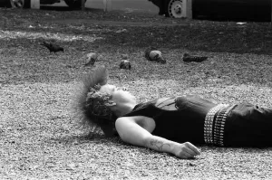 A punk relaxing in midday sun in Chelsea's Kings Road. 20th August 1984 A punk relaxing in midday sun in Chelsea's Kings Road. 20th August 1984