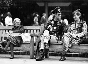 Two punk rockers sitting on a bench in Birmingham, seated next to them is an elderly lady Two punk rockers sitting on a bench in Birmingham, seated next to them is an elderly lady