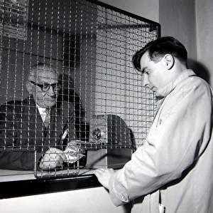 A punter placing a bet at William Massey betting shop in Bethnal Green A punter placing a bet at William Massey betting shop in Bethnal Green