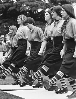 Putting on the style, with their best feet forward are women clog dancers demonstrating Putting on the style, with their best feet forward are women clog dancers demonstrating