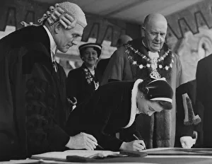 The Queen autographing one of the Royal Portraits at Morecambe with the Mayor Bryce Clegg The Queen autographing one of the Royal Portraits at Morecambe with the Mayor Bryce Clegg