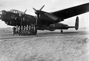 An RAF crew pose for a group photograph beside the veteran Lancaster bomber " An RAF crew pose for a group photograph beside the veteran Lancaster bomber "