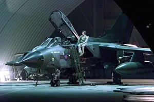 An RAF Tornado jet being prepared for battle in the hangar at Ali Al Salem Air Base in An RAF Tornado jet being prepared for battle in the hangar at Ali Al Salem Air Base in