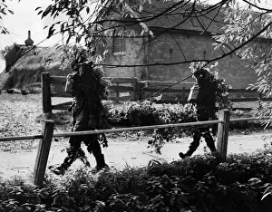 RAMC Stretcher bearers show how to camouflage themselves RAMC Stretcher bearers show how to camouflage themselves