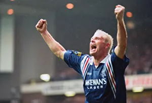 Rangers football player Paul Gascoigne, arms raised in joy after scoring a goal in their Rangers football player Paul Gascoigne, arms raised in joy after scoring a goal in their