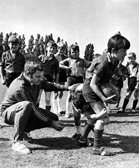 Ray Williams, WRU coaching organiser, and youngsters at a coaching session. Circa 1973 Ray Williams, WRU coaching organiser, and youngsters at a coaching session. Circa 1973