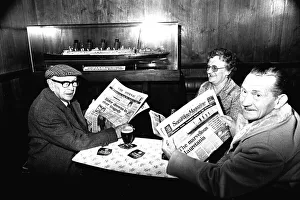 Three regulars at the Mauretania Pub in Wallsend, reading a copy of the Newcastle Journal Three regulars at the Mauretania Pub in Wallsend, reading a copy of the Newcastle Journal