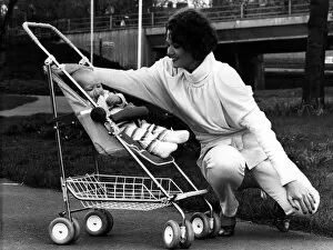 Images Dated 19th April 1984: Rena pictured in a 1984-style jump suit and baby Thea relaxes in the new McLaren Dreamer