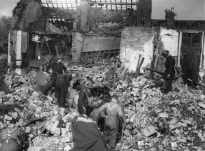 Rescue workers search rubble for survivors after a parachute mine detonated on Bean Rescue workers search rubble for survivors after a parachute mine detonated on Bean