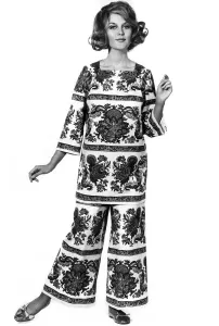 Reveille Fashions. Delia Freeman. modelling trouser suit made of white cotton boldly Reveille Fashions. Delia Freeman. modelling trouser suit made of white cotton boldly