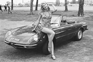 Reveille model Heidi seen here posing with an Alpha Romeo which is top prize in Reveille model Heidi seen here posing with an Alpha Romeo which is top prize in