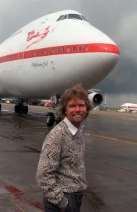 Richard Branson standing in front of one of his Virgin Airways Boeing 747 jumbo jet Richard Branson standing in front of one of his Virgin Airways Boeing 747 jumbo jet