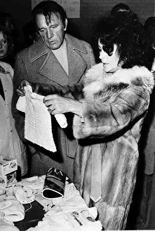 Richard Burton actor and Elizabeth Taylor who recently remarried buying a baby suit Richard Burton actor and Elizabeth Taylor who recently remarried buying a baby suit
