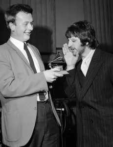 Ringo Starr sings into a toy gramaphone after sound engineer Geoff Emerick won a Grammy Ringo Starr sings into a toy gramaphone after sound engineer Geoff Emerick won a Grammy