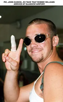Robbie Williams arrives Glasgow Airport V sign T In The Park festival Robbie Williams arrives Glasgow Airport V sign T In The Park festival
