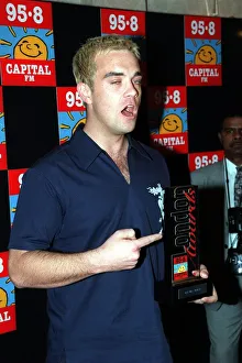 Robbie Williams at Capital Radio Awards April 1998 Holding an award Robbie Williams at Capital Radio Awards April 1998 Holding an award