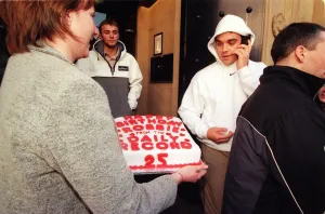 Robbie Williams gets a 25th birthday cake from Margaret Mallon February 1999 as he walks Robbie Williams gets a 25th birthday cake from Margaret Mallon February 1999 as he walks