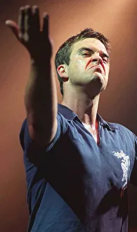 Robbie Williams makes a face to the audience at his concert at the SECC Glasgow February Robbie Williams makes a face to the audience at his concert at the SECC Glasgow February