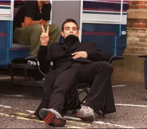Robbie Williams relaxes on the set of his lastest video being shot in the grounds of Robbie Williams relaxes on the set of his lastest video being shot in the grounds of