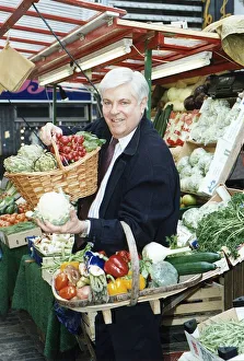 Robert Carrier TV chef Television Standing at a fruit stall Holding baskets of Robert Carrier TV chef Television Standing at a fruit stall Holding baskets of