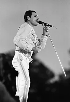 Rock group Queen in concert at Knebworth pop festival. Lead singer Freddie Mercury Rock group Queen in concert at Knebworth pop festival. Lead singer Freddie Mercury